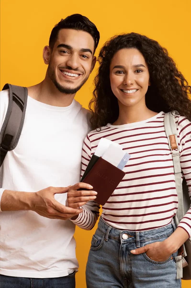 A happy couple with their flight reservations
